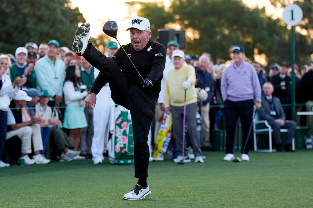 Gary Player kicks his leg in the air after hitting the ceremonial tee shot on the first hole during the first round of the Masters golf tournament at the Augusta National Golf Club, Thursday, April 9, 2026, in Augusta, Ga.