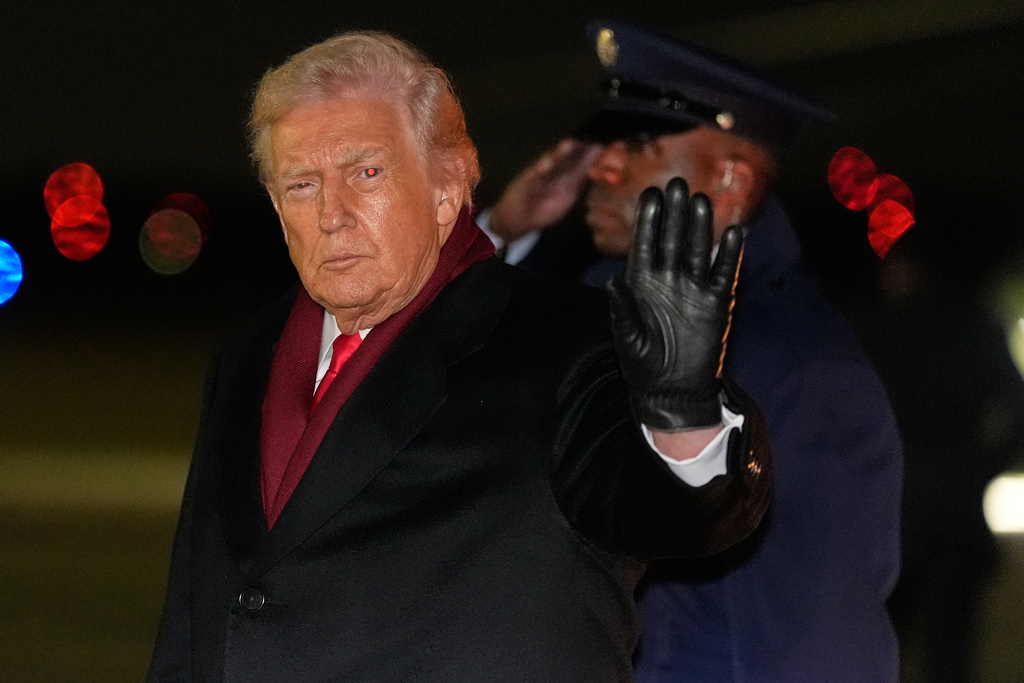 President Donald Trump waves as he arrives on Air Force One, Tuesday, Dec. 9, 2025, at Joint Base Andrews, Md. 