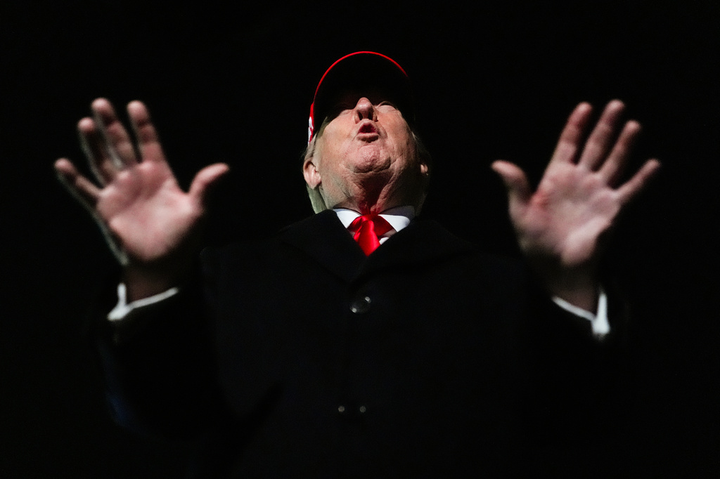 President Donald Trump speaks with reporters after disembarking Air Force One, Sunday, April 12, 2026, at Joint Base Andrews, Md.