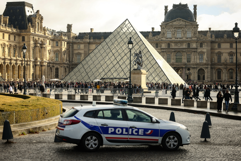 A police car parks in the courtyard of the Louvre museum, one week after the robbery, on Oct. 26, 2025, in Paris. 
