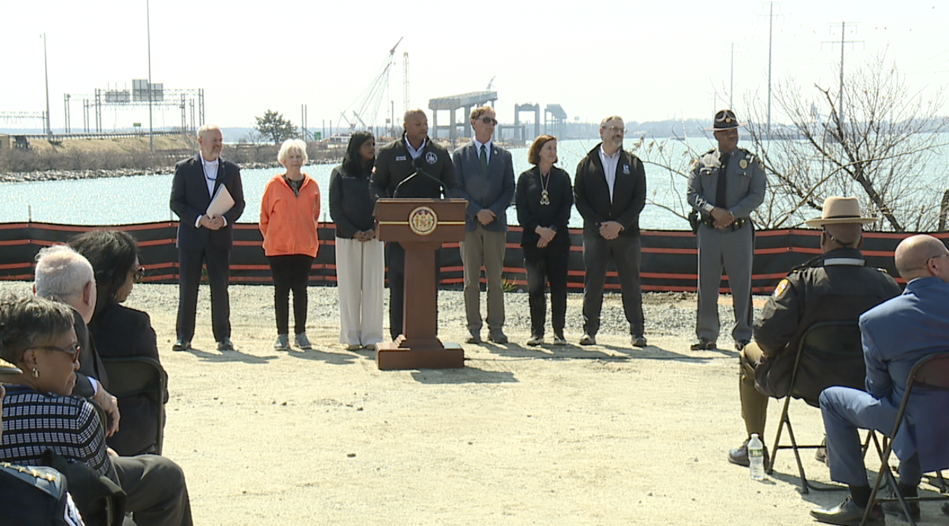 Maryland leaders at a press conference in front of the Key Bridge