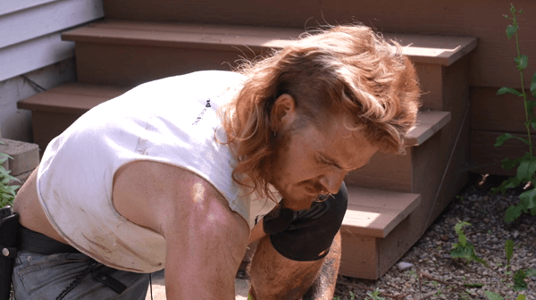 Guy with a mullet landscaping
