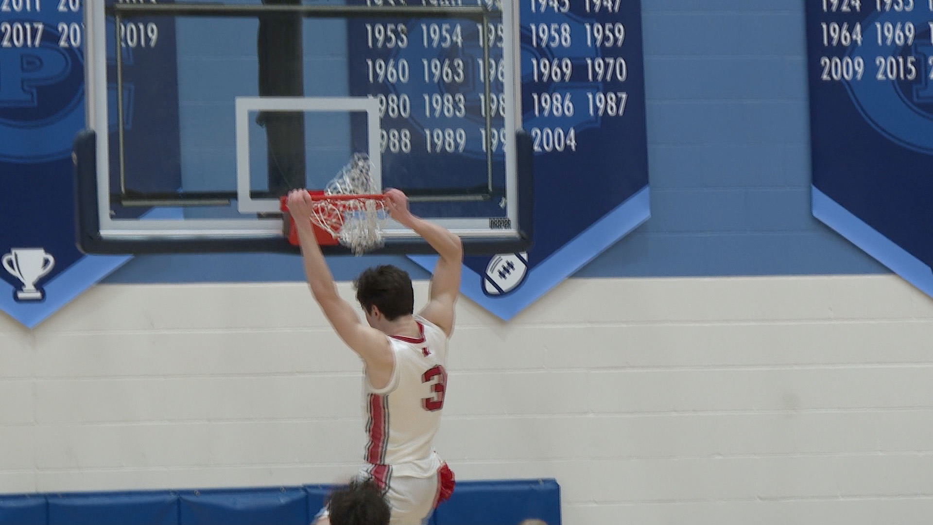 Omaha Westside's Emre Gedik dunks in the Warriors' Metro Holiday Tournament win over Creighton Prep.