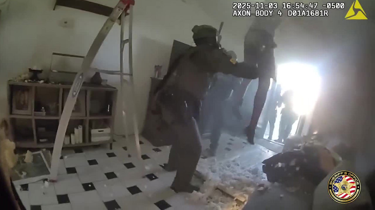 Video posted by the Indian River County Sheriff's Office shows a man identified as Keith Rodgers falling through the ceiling of a home and being taken into custody by a SWAT team on Nov. 3, 2025.