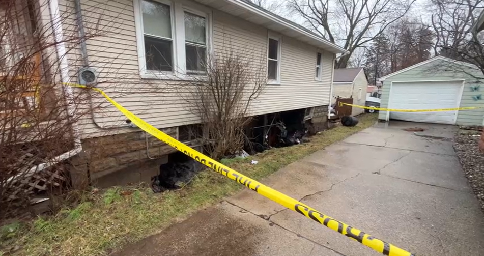 Grand Rapids flood caves in basement wall 