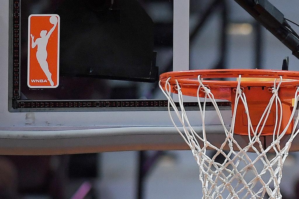 The WNBA logo is seen near a hoop before an WNBA basketball game at Mohegan Sun Arena, May 14, 2019, in Uncasville, Conn. 