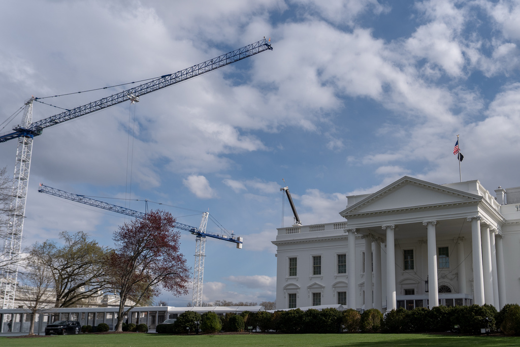 Construction cranes work around the White House, Tuesday, March 17, 2026, in Washington.