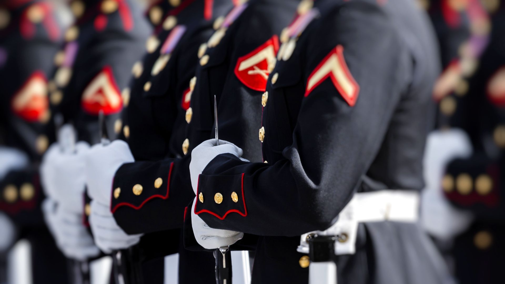 Stock image shows U.S. Marines in uniform.