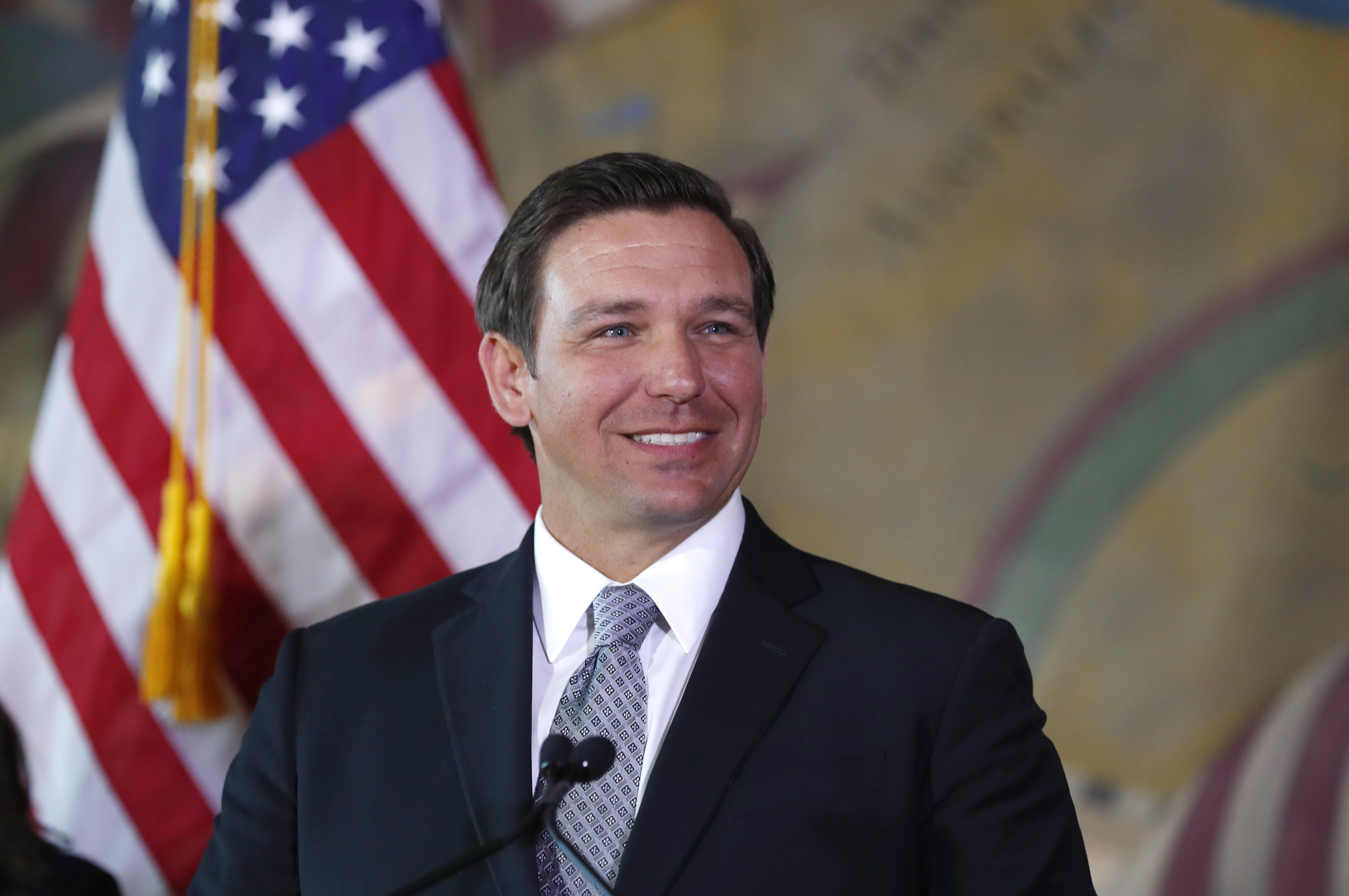 Gov. Ron DeSantis smiles during news conference in Miami, Jan. 9, 2019