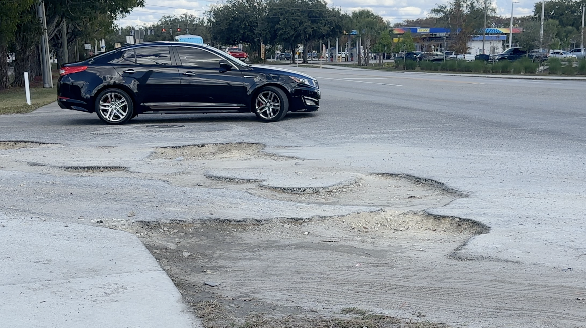 A car avoiding the potholes