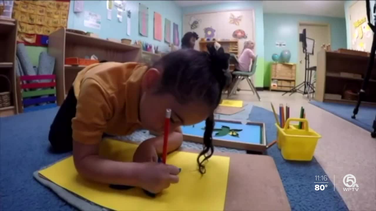 Kid drawing on the ground