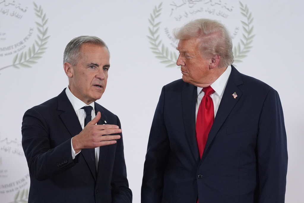 President Donald Trump greets Canada's Prime Minister Mark Carney during a summit to support ending the more than two-year Israel-Hamas war in Gaza after a breakthrough ceasefire deal, Monday, Oct. 13, 2025, in Sharm El Sheikh, Egypt.