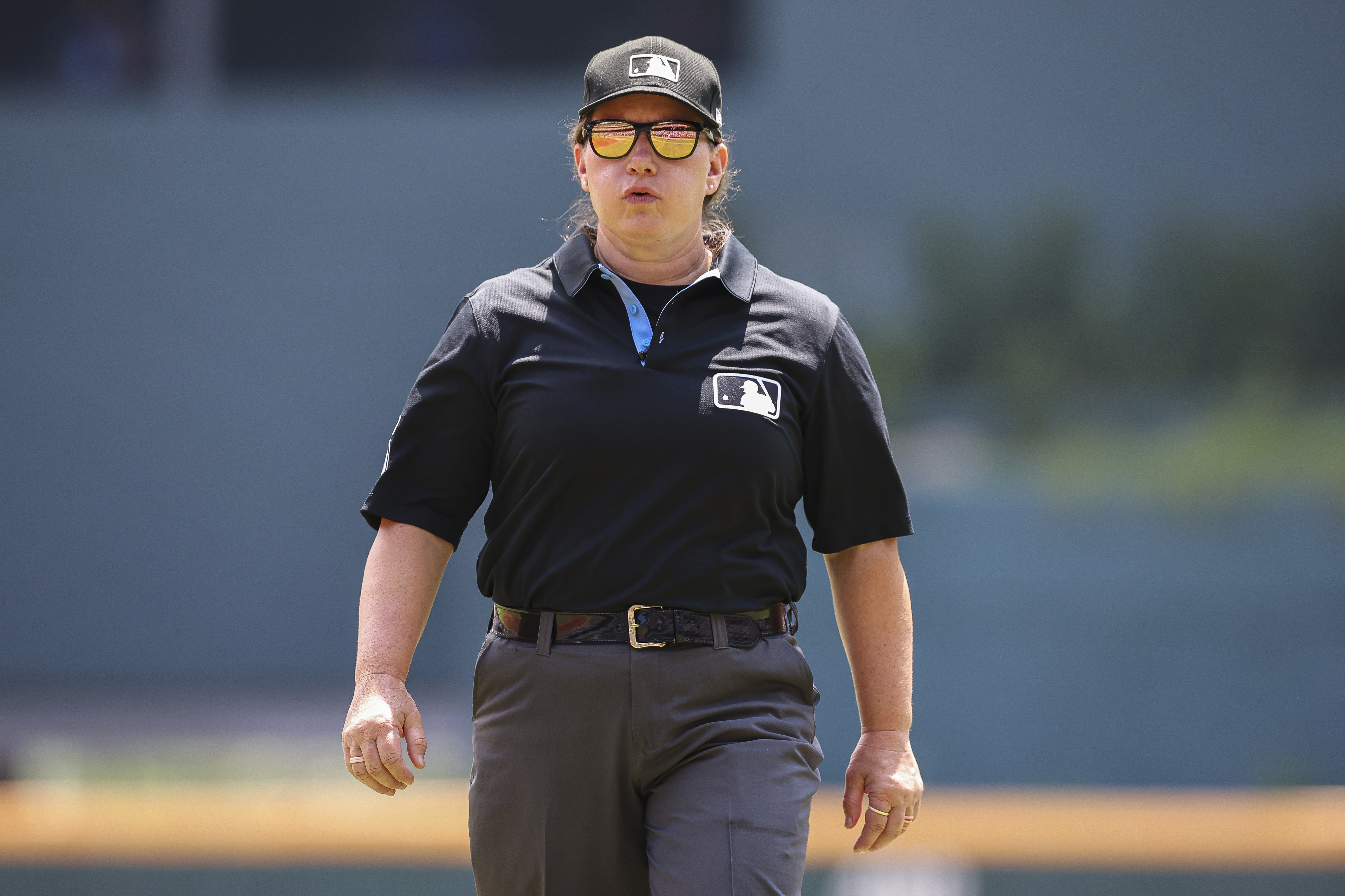 Umpire Jen Pawol, looks on during the first inning of a baseball game of a doubleheader between the Atlanta Braves and Miami Marlins, Saturday, Aug. 9, 2025, in Atlanta. 