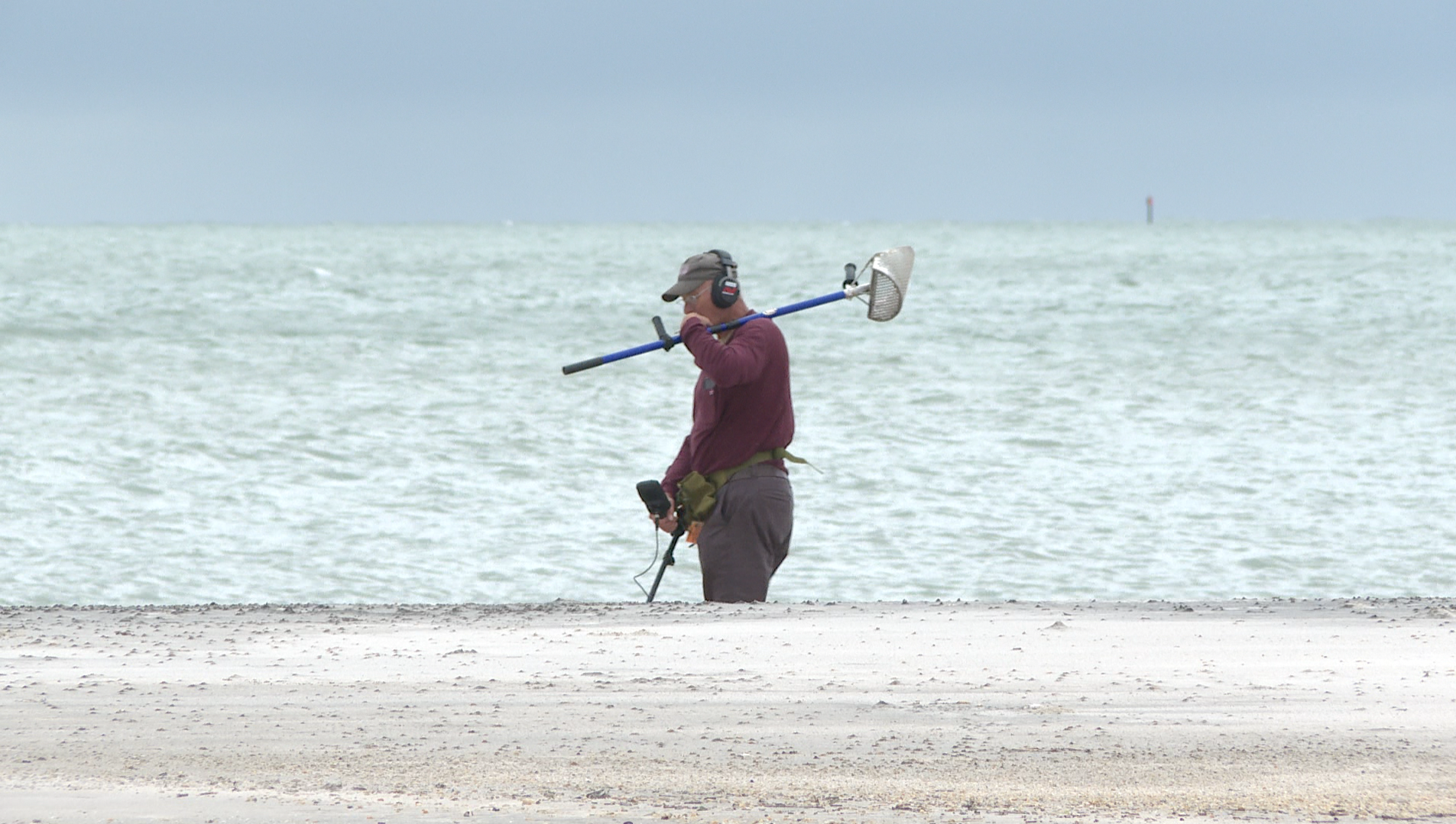 Guy metal detecting at Buckroe Beach