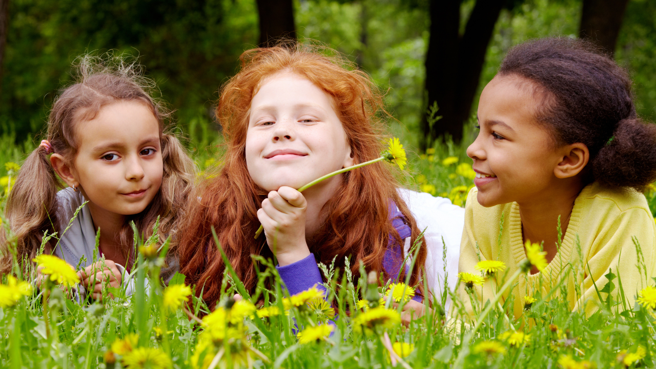 Children Outside Laying in a Field (FILE)