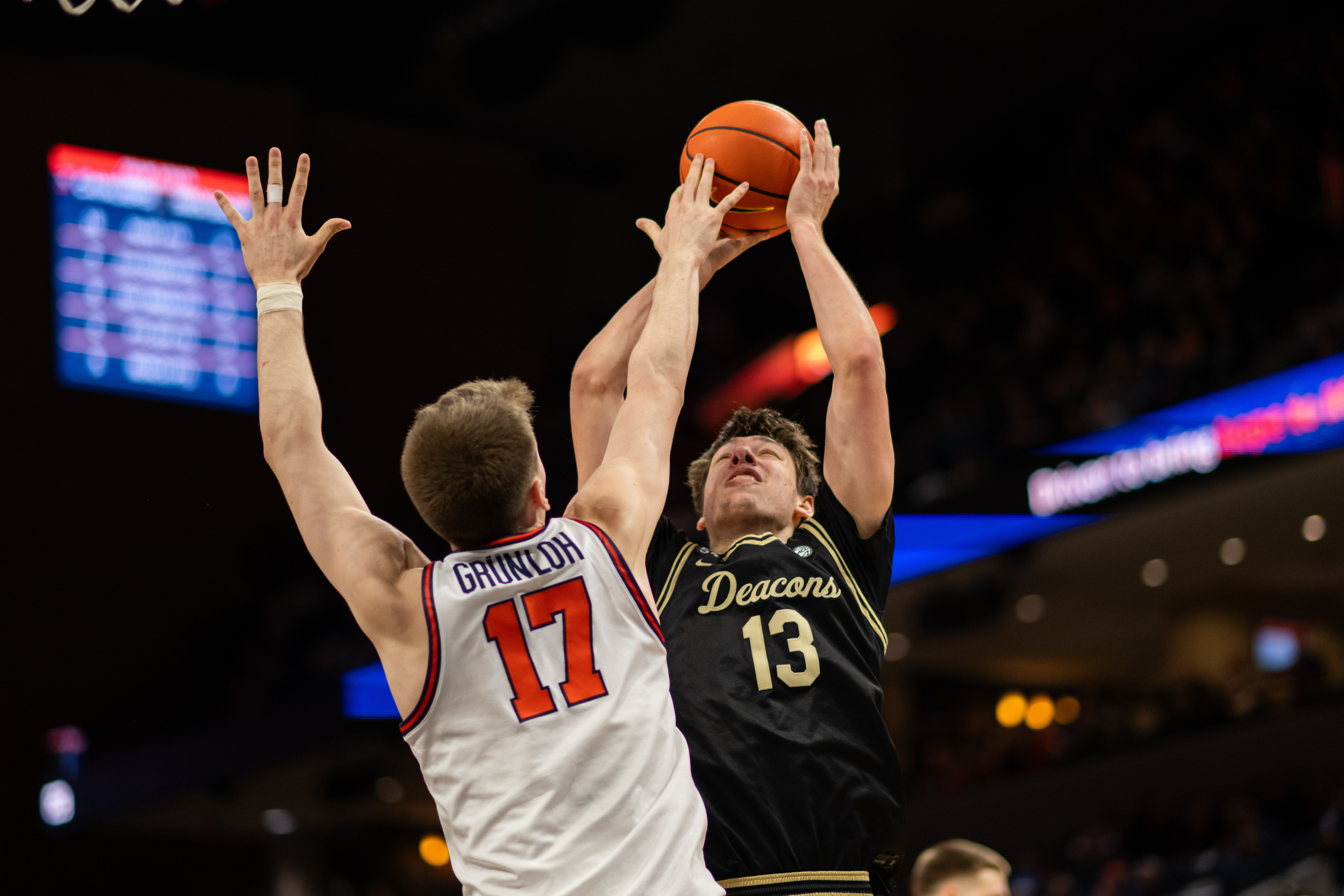 Virginia center Johann Grünloh (17), Wake Forest forward Cooper Schwieger (13)