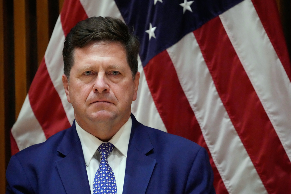 FILE - Jay Clayton, U.S. Attorney for the Southern District of New York, listens during a news conference in New York, March 9, 2026.