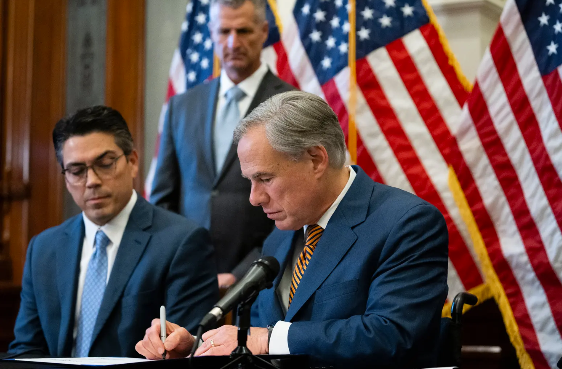 CaptureGov. Greg Abbott signs Senate Bill 2 and Senate Bill 3 at the Texas Capitol on Tues, Jun. 8, 2022. The omnibus power grid bills will change the state’s power grid and the people who oversee it..PNG