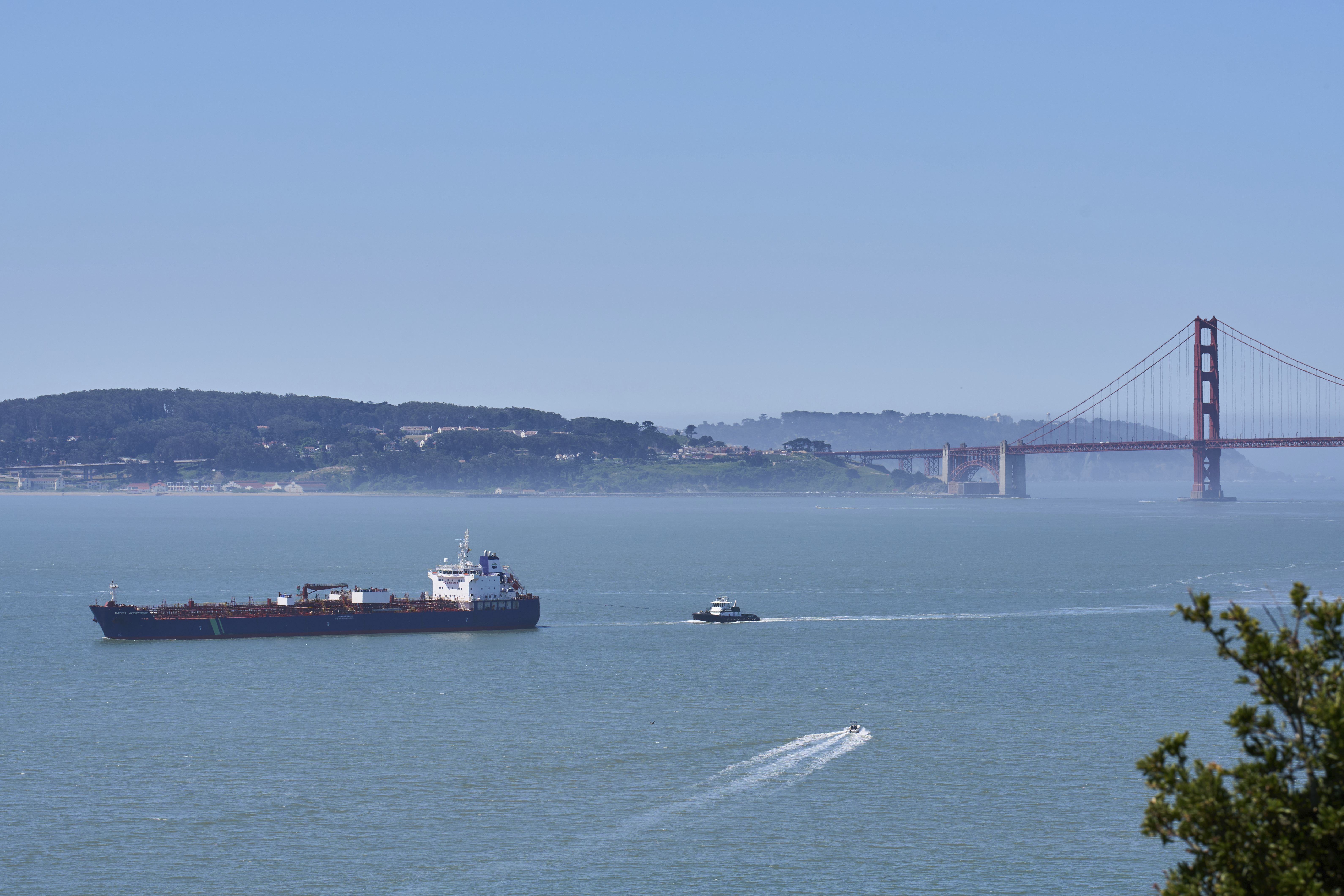 A tanker and other vessels pass through the San Francisco Bay.