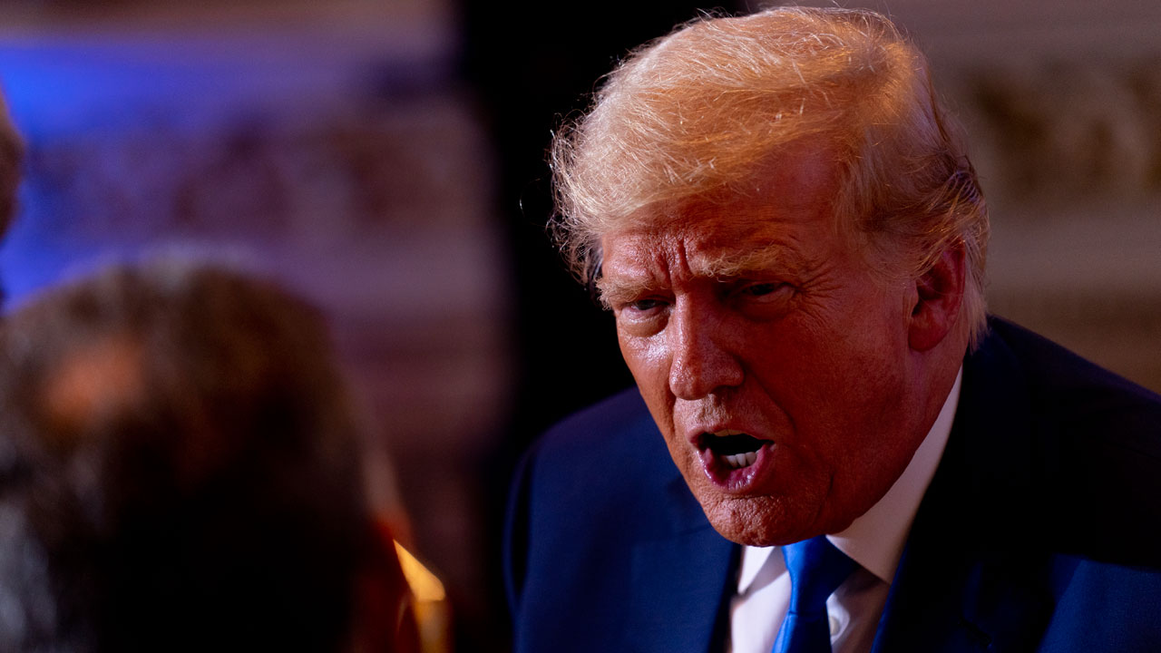 Former President Donald Trump speaks to guests at Mar-a-lago on Election Day, Tuesday, Nov. 8, 2022, in Palm Beach, Fla.