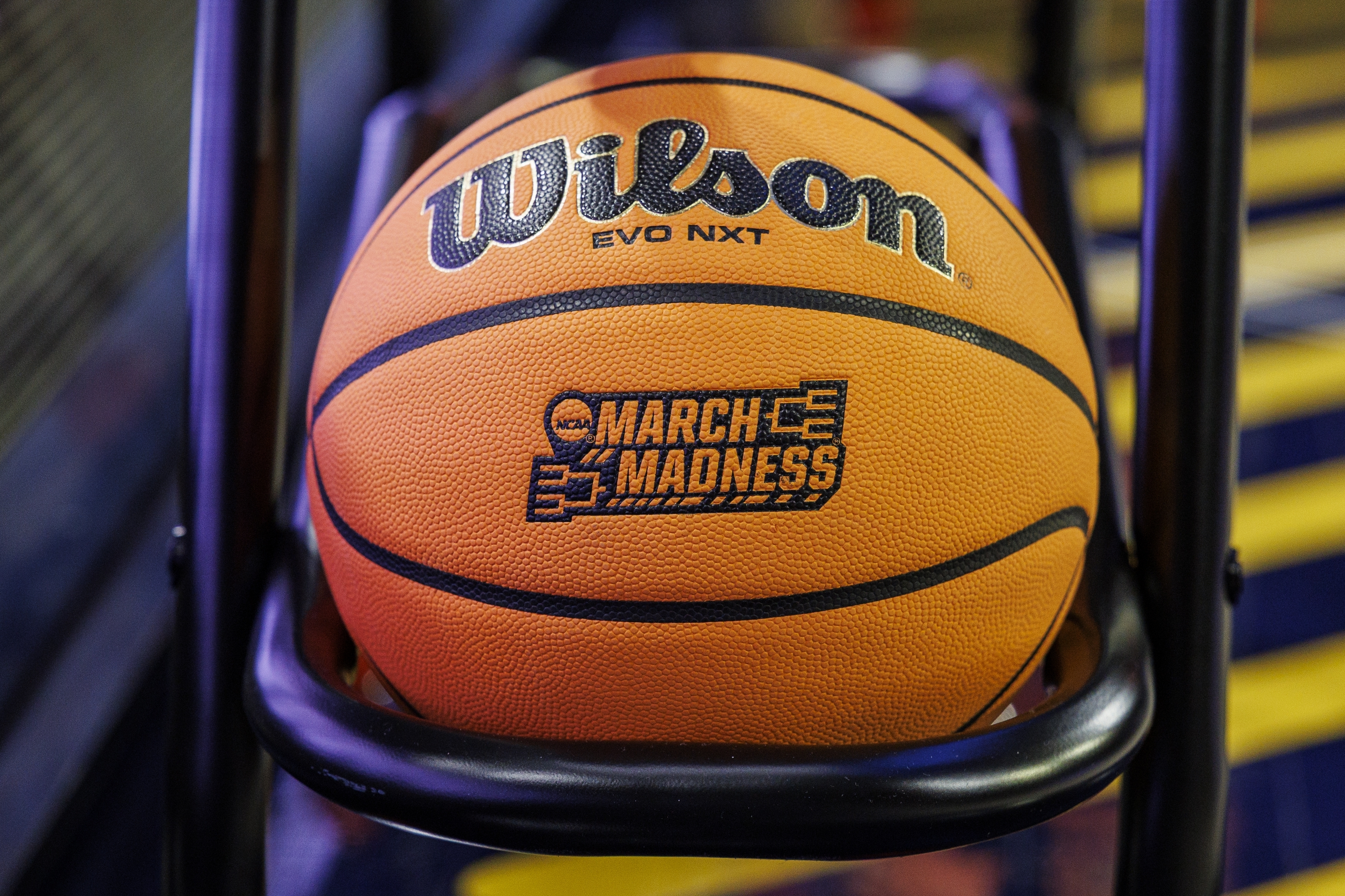 A basketball with a March Madness logo rests on the rack prior to a first-round college basketball game in the NCAA Tournament between Iowa State and Michigan, Friday, March 21, 2025, in South Bend, Ind. 