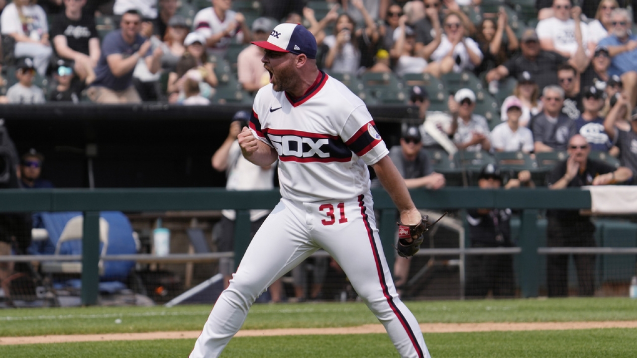 Chicago White Sox relief pitcher Liam Hendriks reacts after striking out a batter.