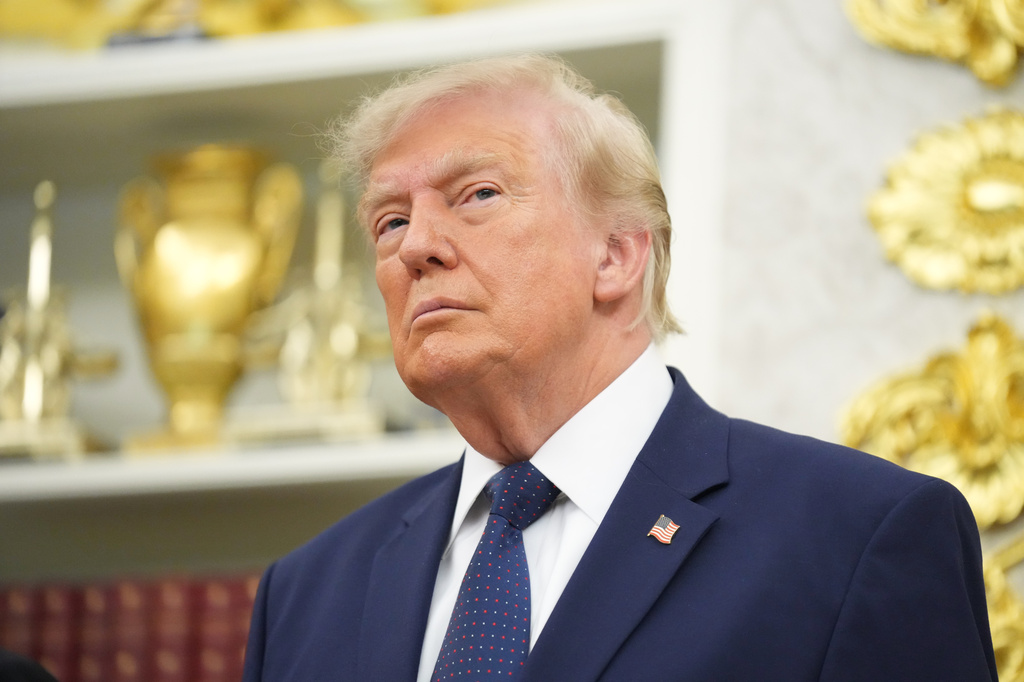 President Donald Trump listens as others speak after ringing the opening bell for the New York Stock Exchange and the Nasdaq in the Oval Office at the White House, Monday, July 6, 2026, in Washington. 