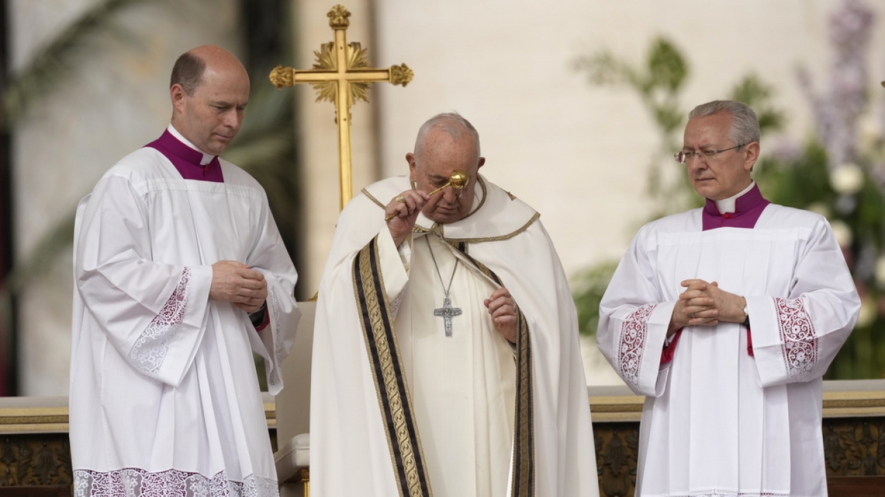 Pope Francis asperses holy water as he celebrates Easter mass in St. Peter's Square at the Vatican, Sunday, March 31, 2024.