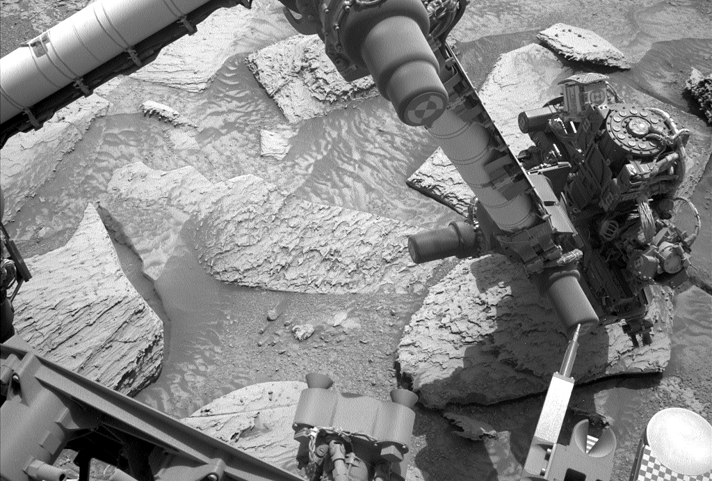NASA rover shakes off stuck rock.