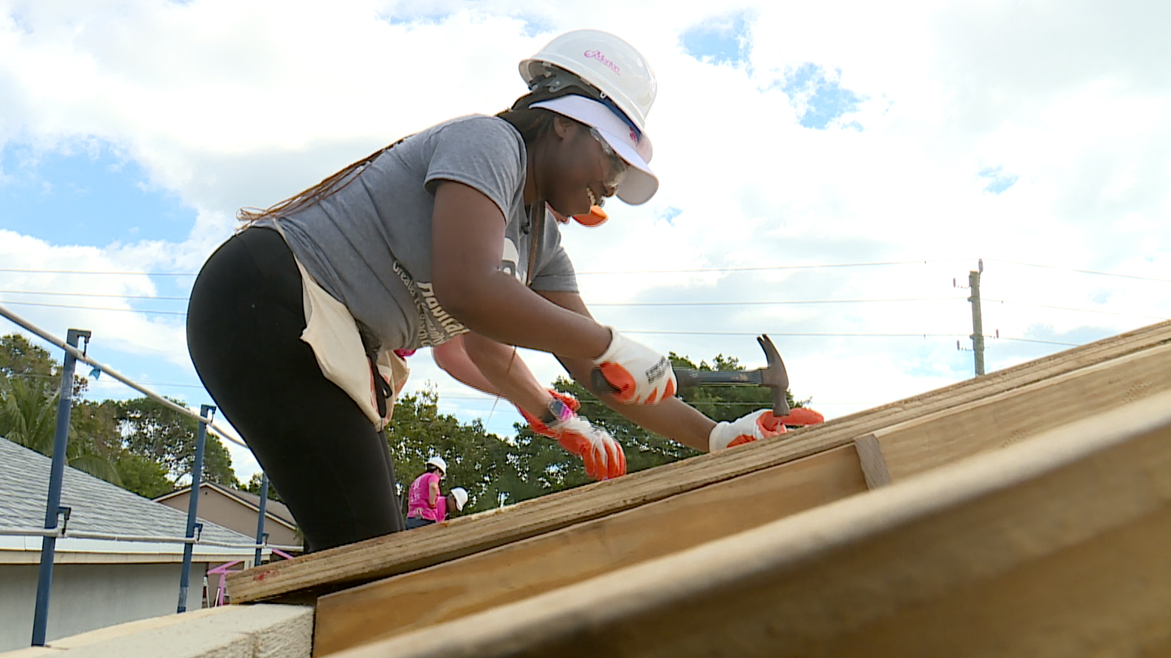One-hundred-fifty women, including leaders from across Palm Beach County, grabbed hard hats, hammers and paint brushes for the annual "Women Build" event in Delray Beach. 