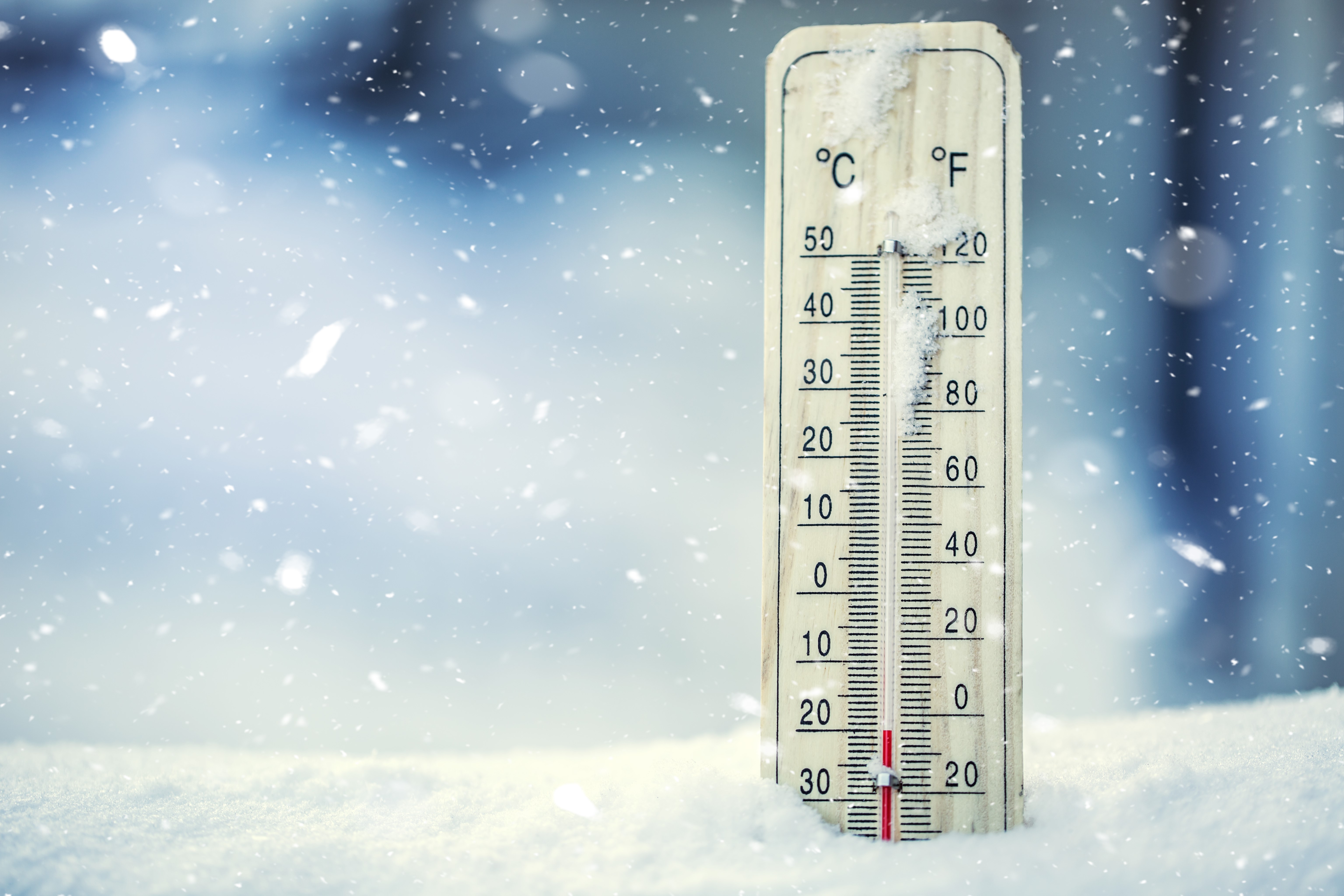 Thermometer,On,Snow,Shows,Low,Temperatures,In,Celsius,Or,Farenheit.