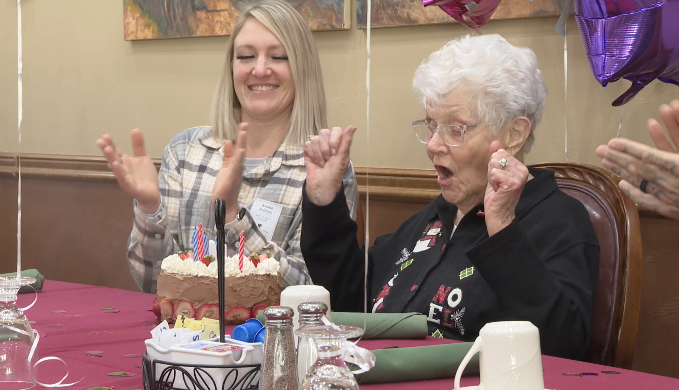 Vira Amende celebrates after blowing out the candles on her cake at her 104th birthday party on Tuesday, December 17, 2024, in Twin Falls.