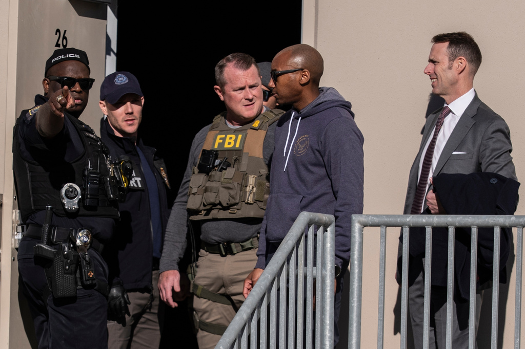 FBI agents are seen at the Fulton County Election Hub and Operation Center, Jan. 28, 2026, in Union City, Ga., near Atlanta. 