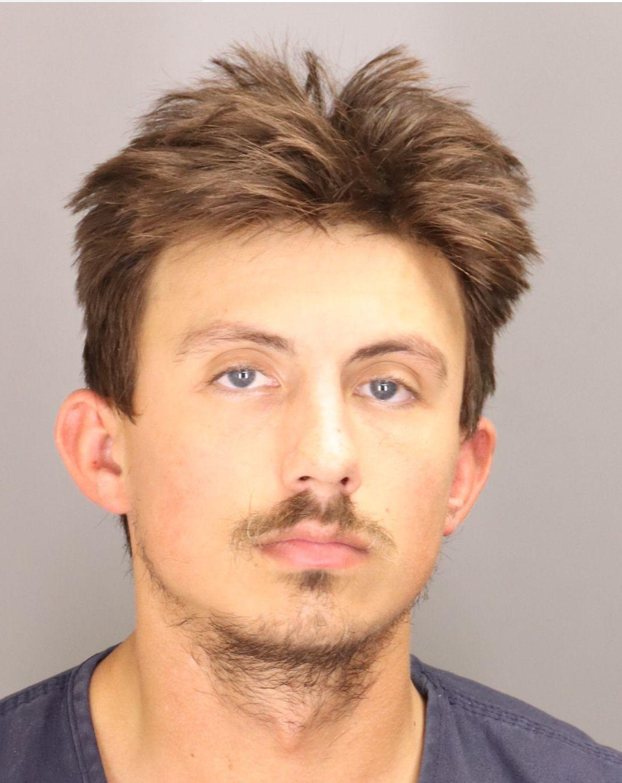 Abela mugshot.png