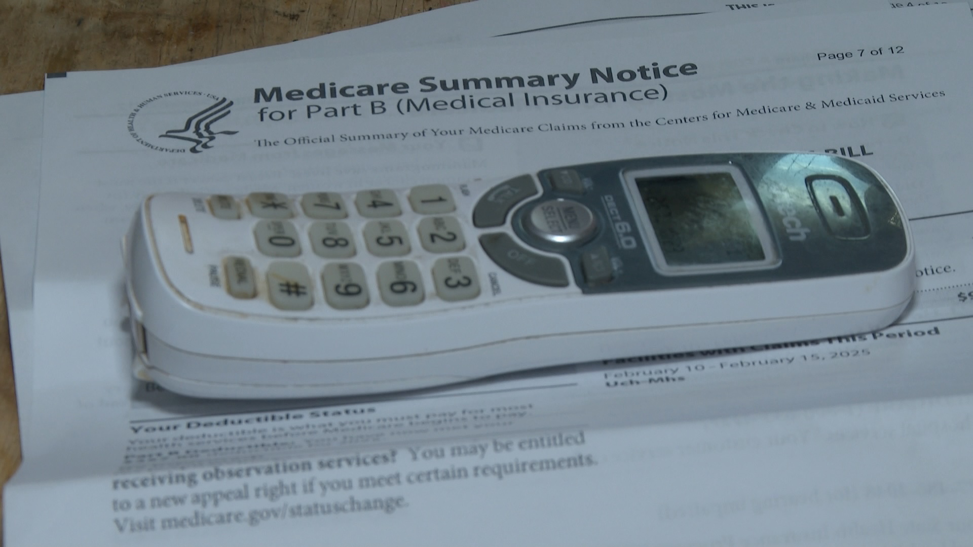 Medicare paperwork under a home phone