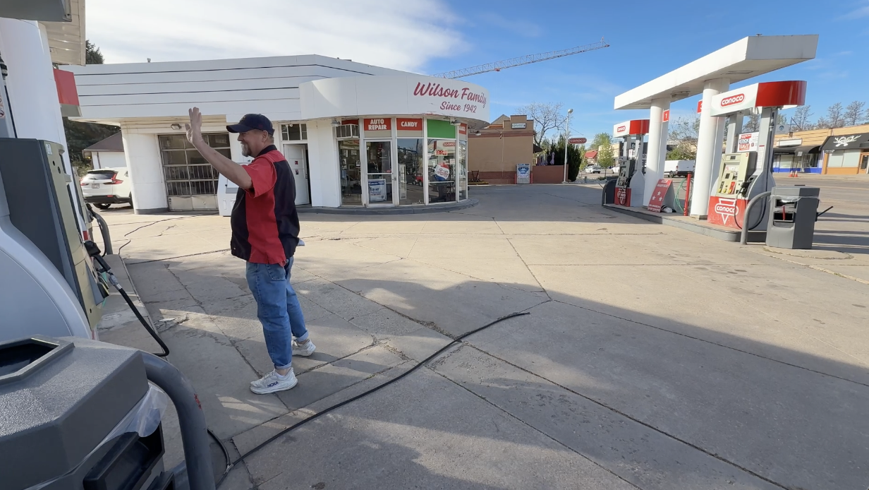 Ken Wilson waves to a customer at the Bonnie Brae Conoco