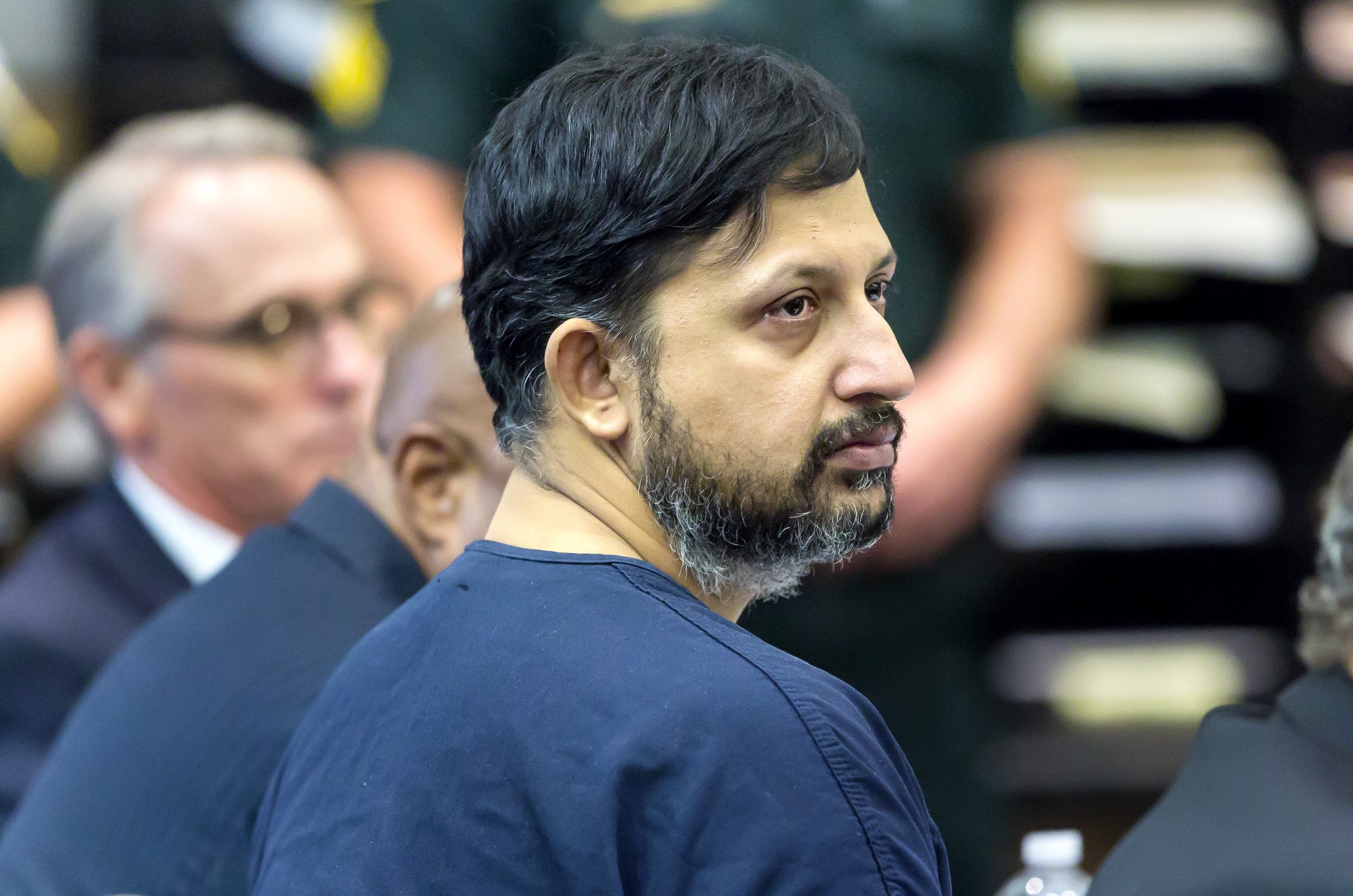 Nouman Raja listens to Chief Assistant State Attorney Adrienne Ellis during his sentencing hearing Thursday in West Palm Beach April 25, 2019. Raja, a former Palm Beach Gardens police officer, was convicted on one count each of manslaughter by culpable negligence and first-degree attempted murder. He shot and killed stranded motorist Corey Jones Oct. 18, 2015.