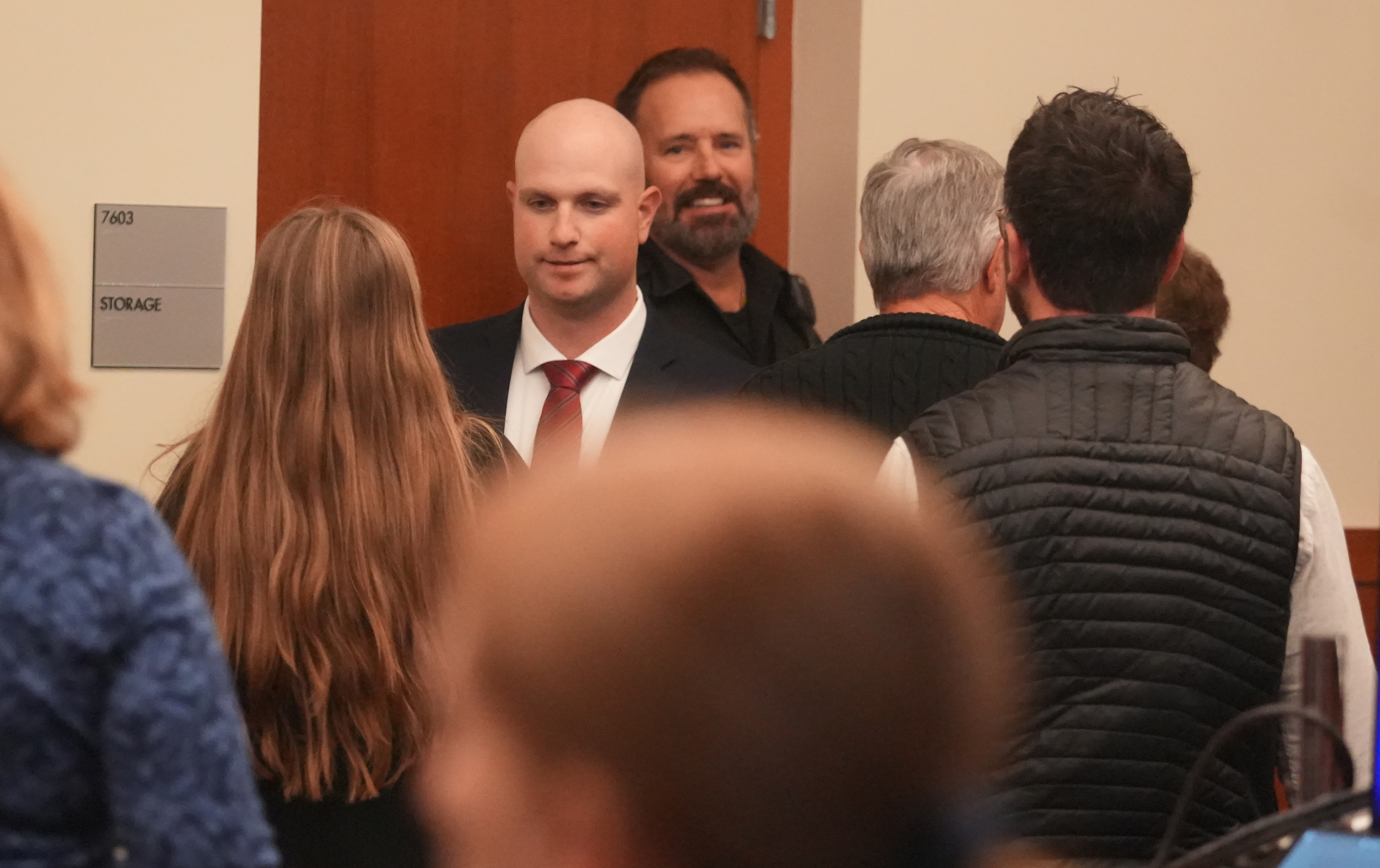 Blendon Township police officer Connor Grubb  greets a family member Friday, Nov. 21, 2025 after the not guilty verdict is read at Franklin County Common Pleas Court in Columbus, Ohio on Friday, Nov. 21, 2025.  