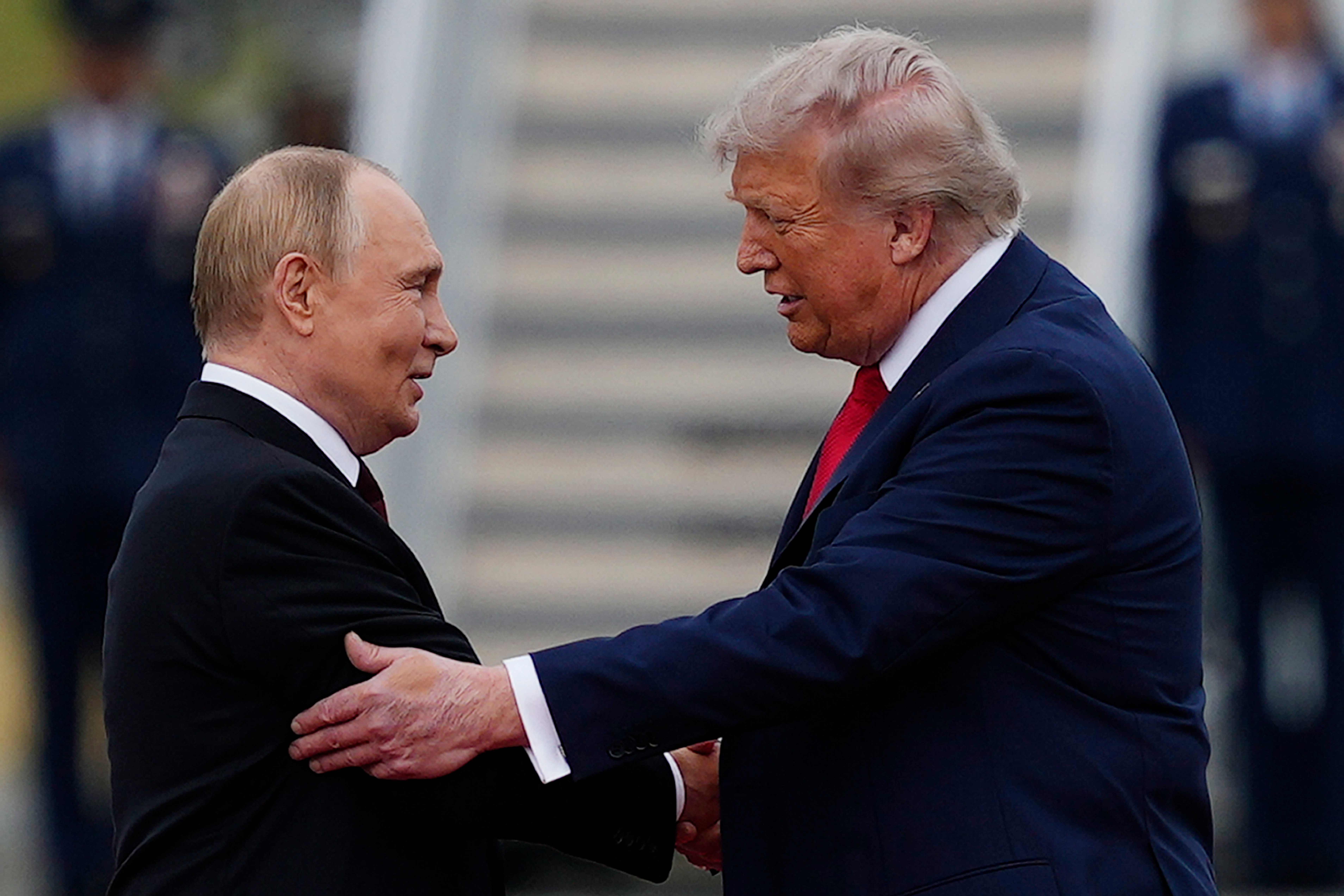 FILE - U.S. President Donald Trump greets Russian President Vladimir Putin, Aug. 15, 2025, at Joint Base Elmendorf-Richardson, Alaska.