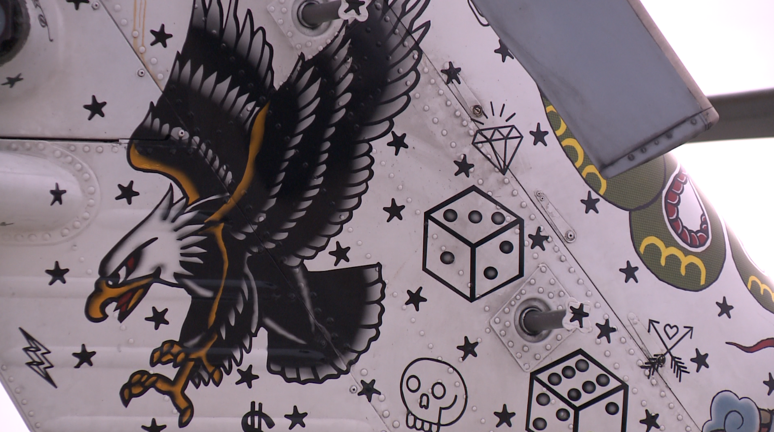 Navy helicopter painted with tattoos