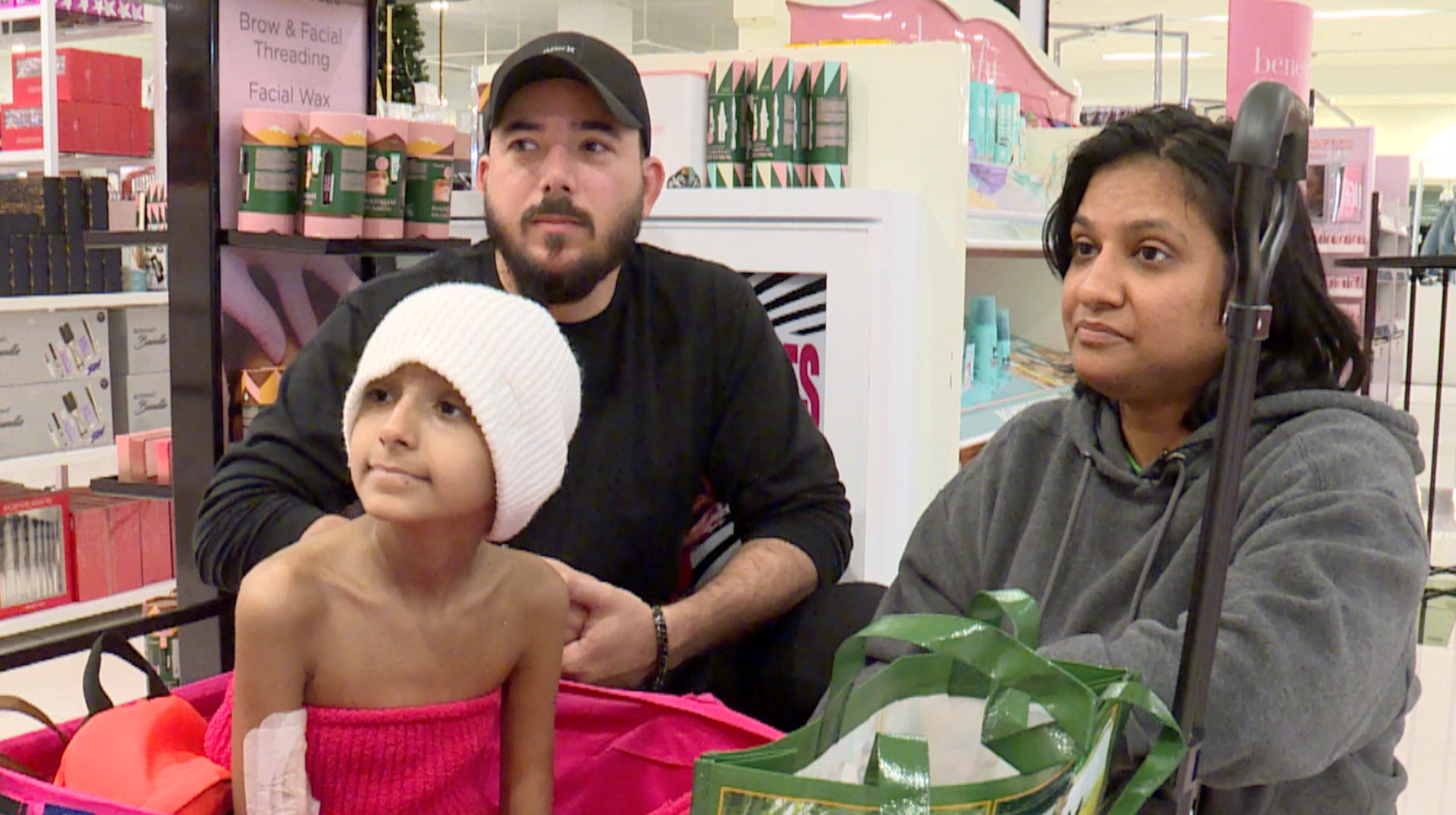 Cancer patient Army Stockstill with her parents Cody and Sharda at the Mall at Wellington Green.