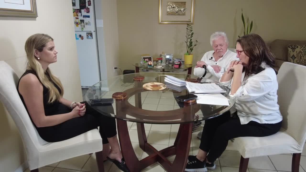 Jessica Bruno speaks to Gloria and Antonio Castro about letters they received from Social Security Administration, December 2023