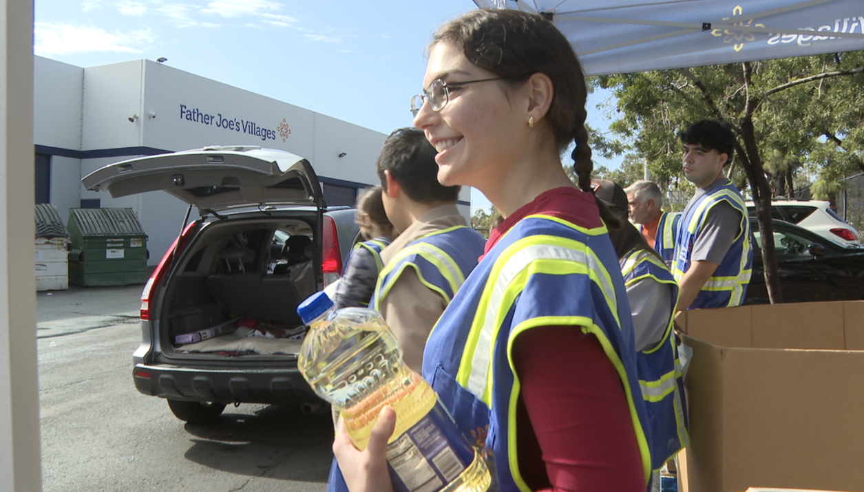 Volunteers helped distribute the essentials on Friday at Father Joe's Villages. 