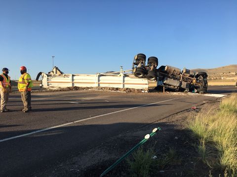Semi rolls over after blowing tire_chicken manure on street
