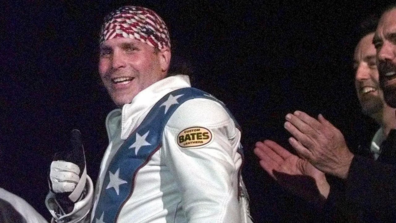 Robbie Knievel gives a thumbs-up after jumping a train at the Texas State Railroad Park in Palestine, Texas, on Feb. 23, 2000. 
AP PHOTO/LM OTERO