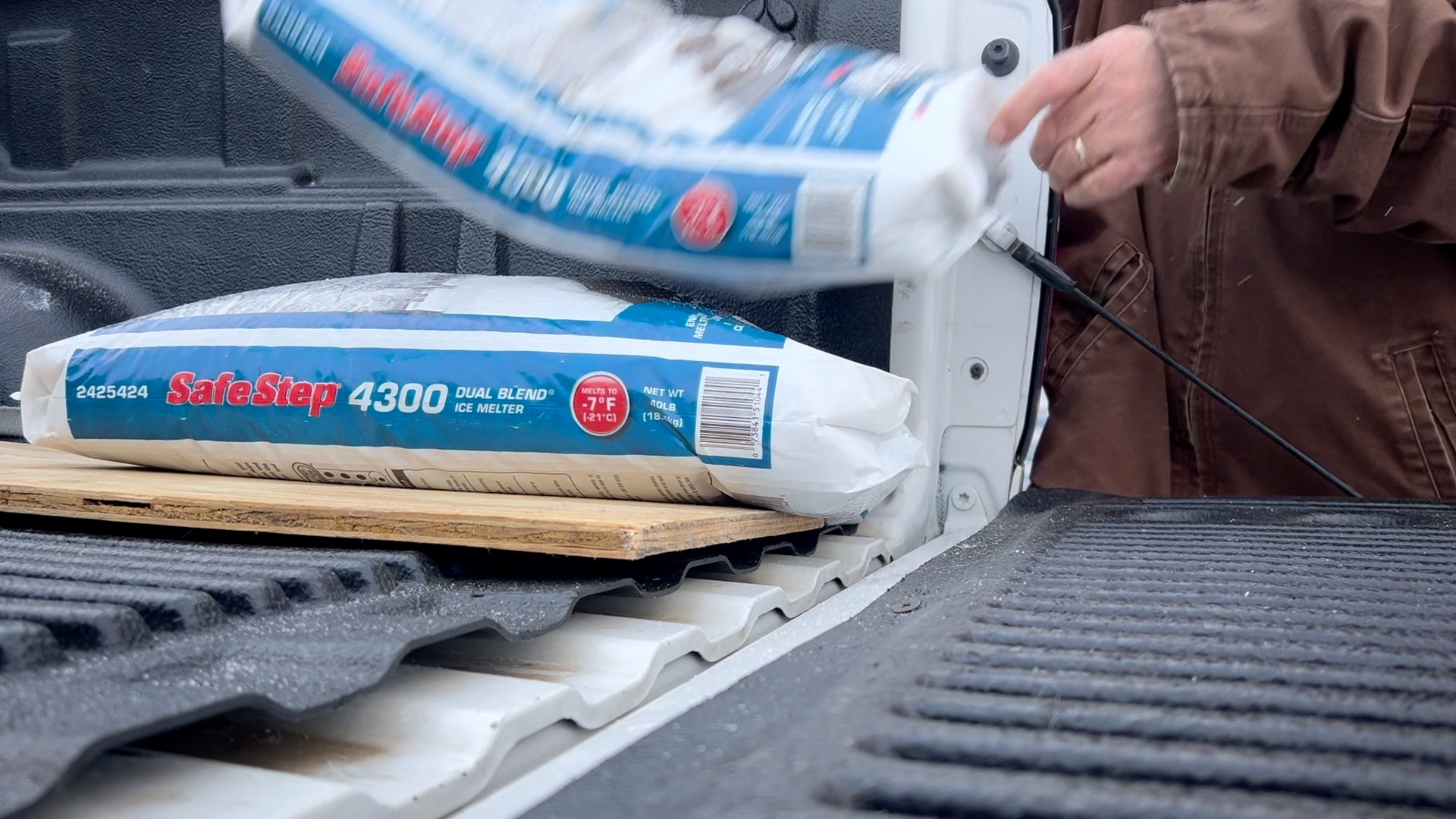 Man drops bag of salt into his truck in DeWitt