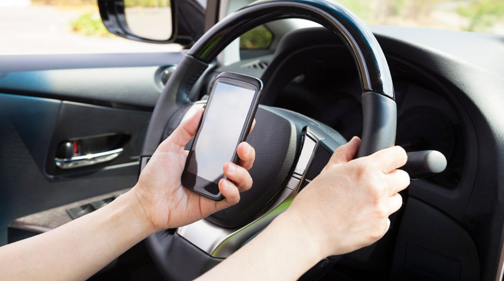 distracted driving stock image.PNG