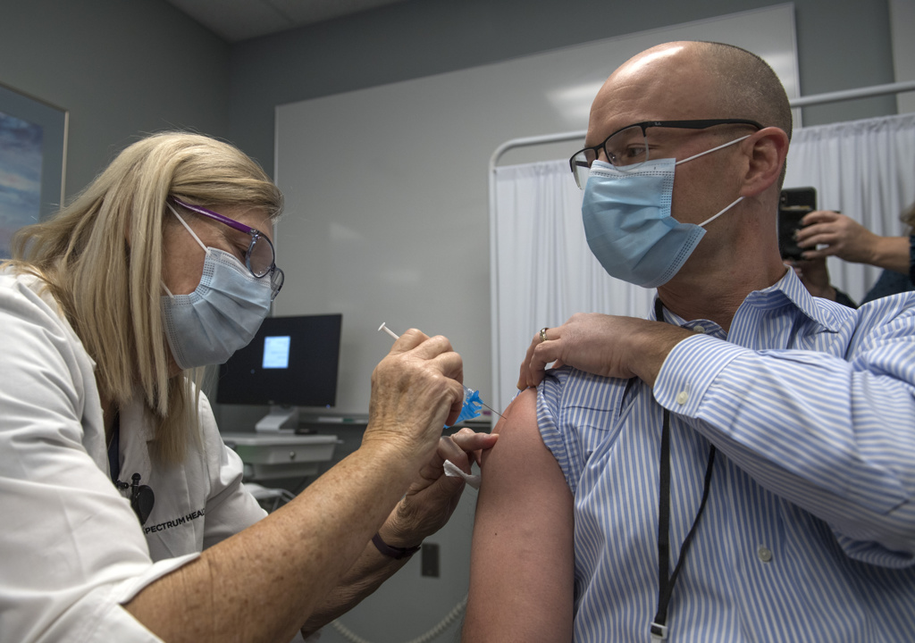 Vaccine first 04. Marc McClelland, MD, receives SH first vaccination.JPG