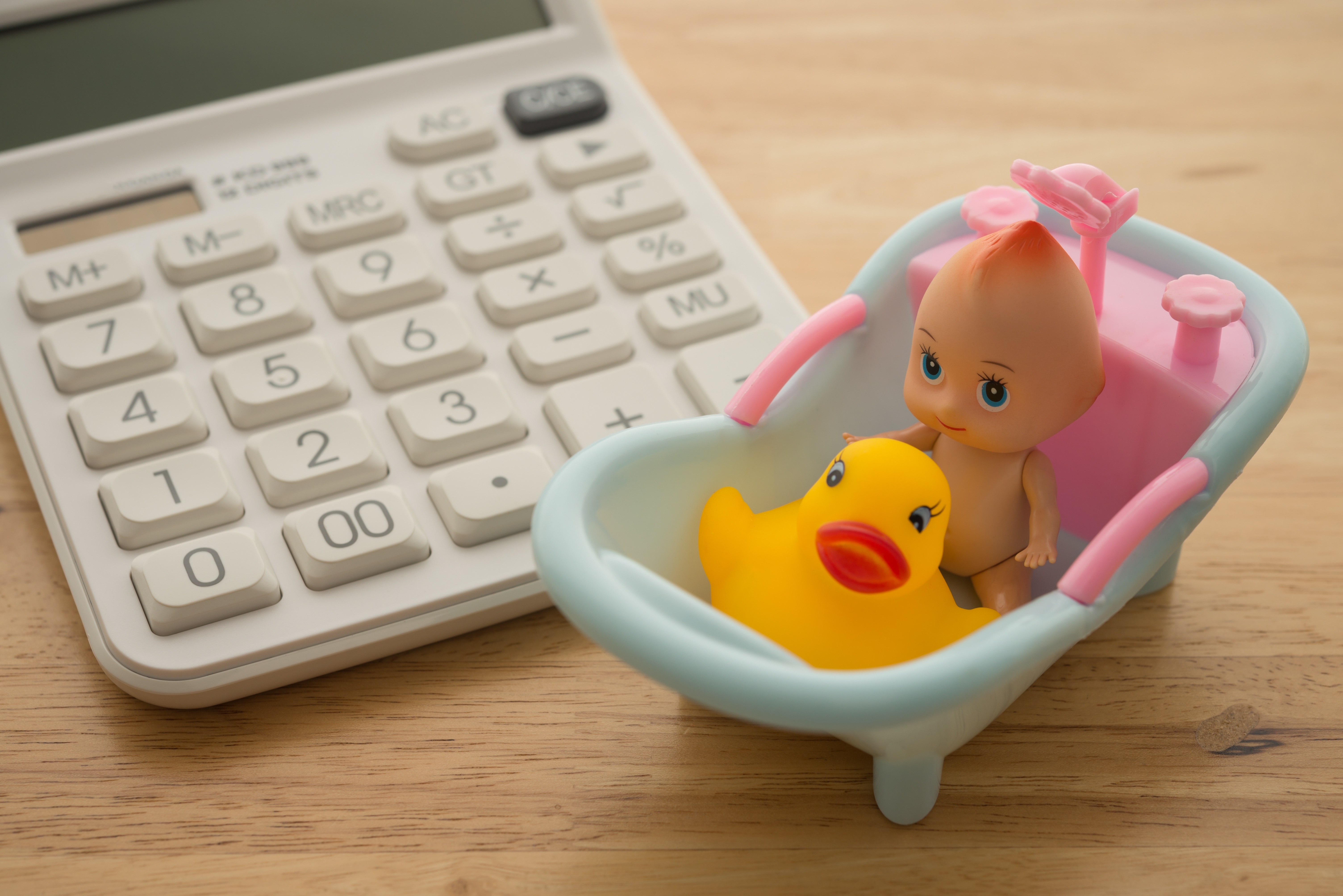 A calculator and a baby toy. 