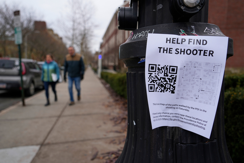 A poster seeking information about the campus shooting suspect is seen on the campus of Brown University, Wednesday, Dec. 17, 2025, in Providence, R.I. 